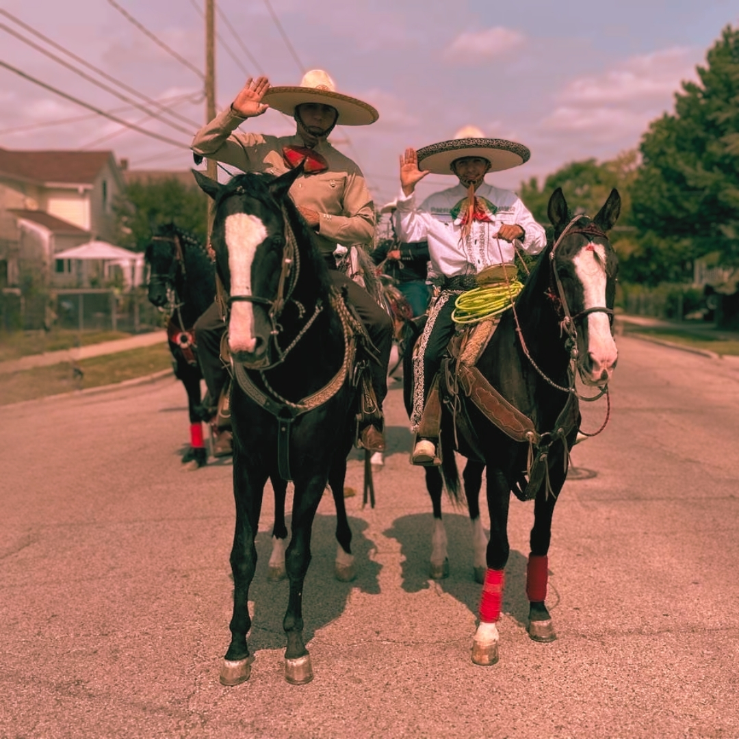 Escamilla and son riding horses