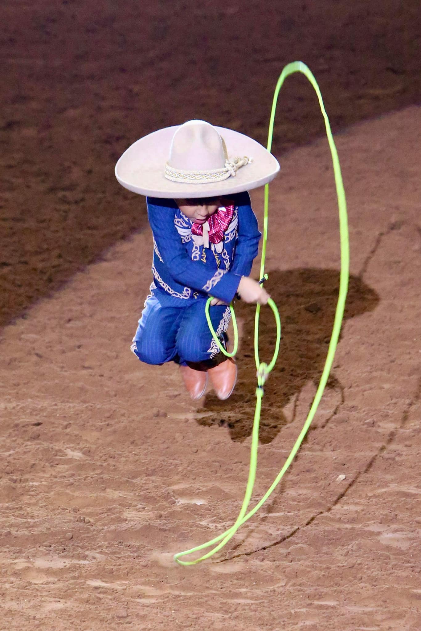 Young charro performing rope tricks